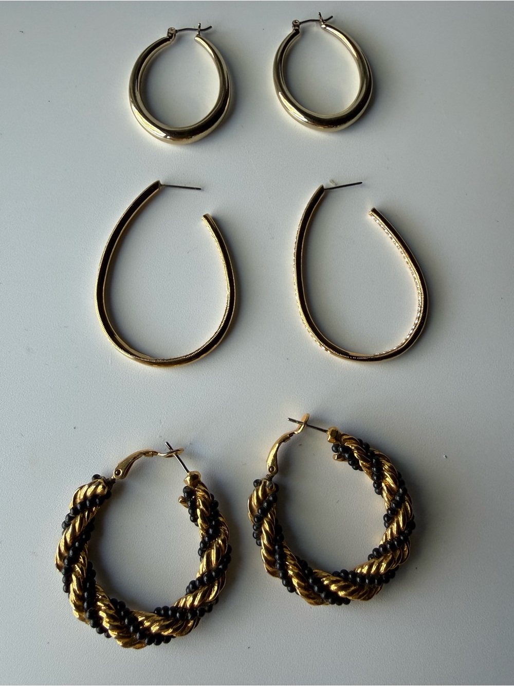 Vintage lot of 3 pairs of gold-tone hoop earrings in three different styles